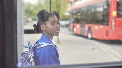 Girl sitting at bus stop