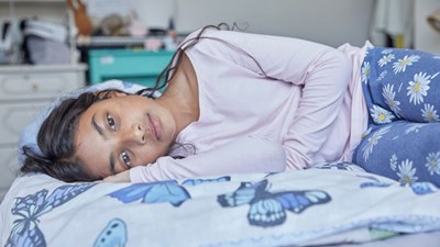 Girl lying on her bed