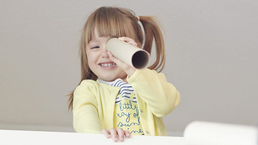 Girl looking through telescope