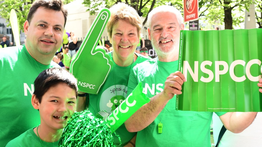 Family dressed in NSPCC t-shirts at a marathon event