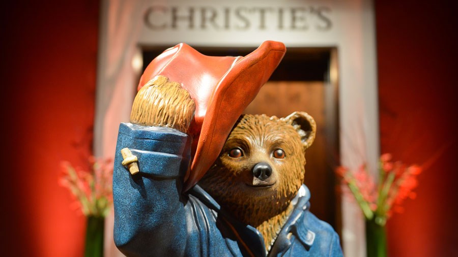 Paddington in front of Christie's sign