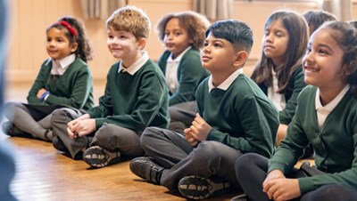 Photograph of children in a school hall.