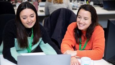 Photograph of two NSPCC employees working in an office.