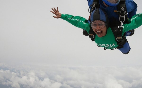 Photograph of a supporter doing a skydive challenge.