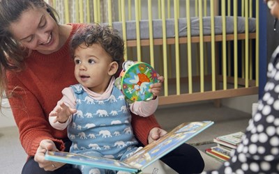 Mother and baby reading a book