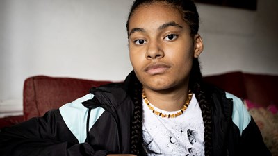 Teenage girl staring blankly into the camera