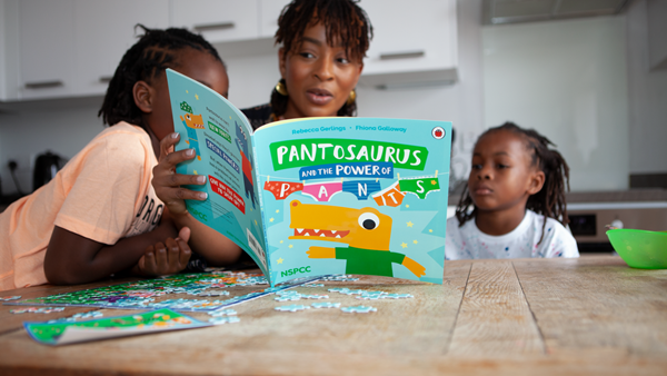 Mum reading the PANTS book with her children