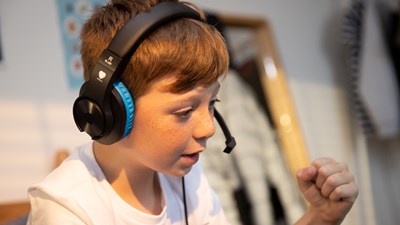 Young boy playing online games