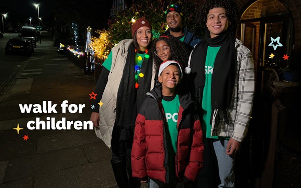 A family in green NSPCC t-shirts about to take part in Walk for Children. There's a Walk for Children ident layered in the bottom left-hand corner.