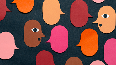 Illustration showing speech bubbles of different colours. Two of them have been designed to look like a face