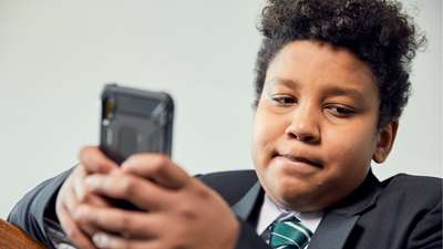 Teenage boy using mobile phone