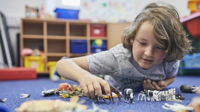 Young person playing with toys