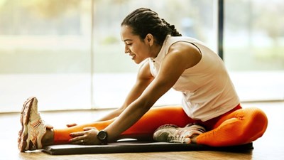 A woman stretching on a yoga mat