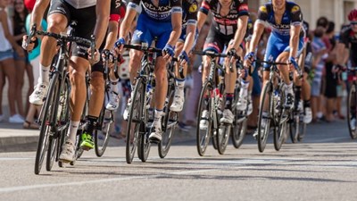 A group of cyclists riding in a race
