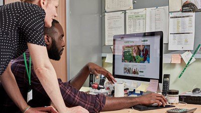 A man and woman using the NSPCC Learning website.