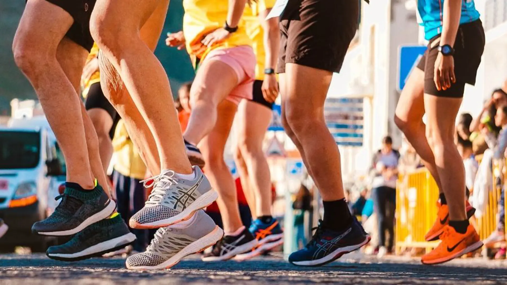 A group of runners feet at the beginning of a race