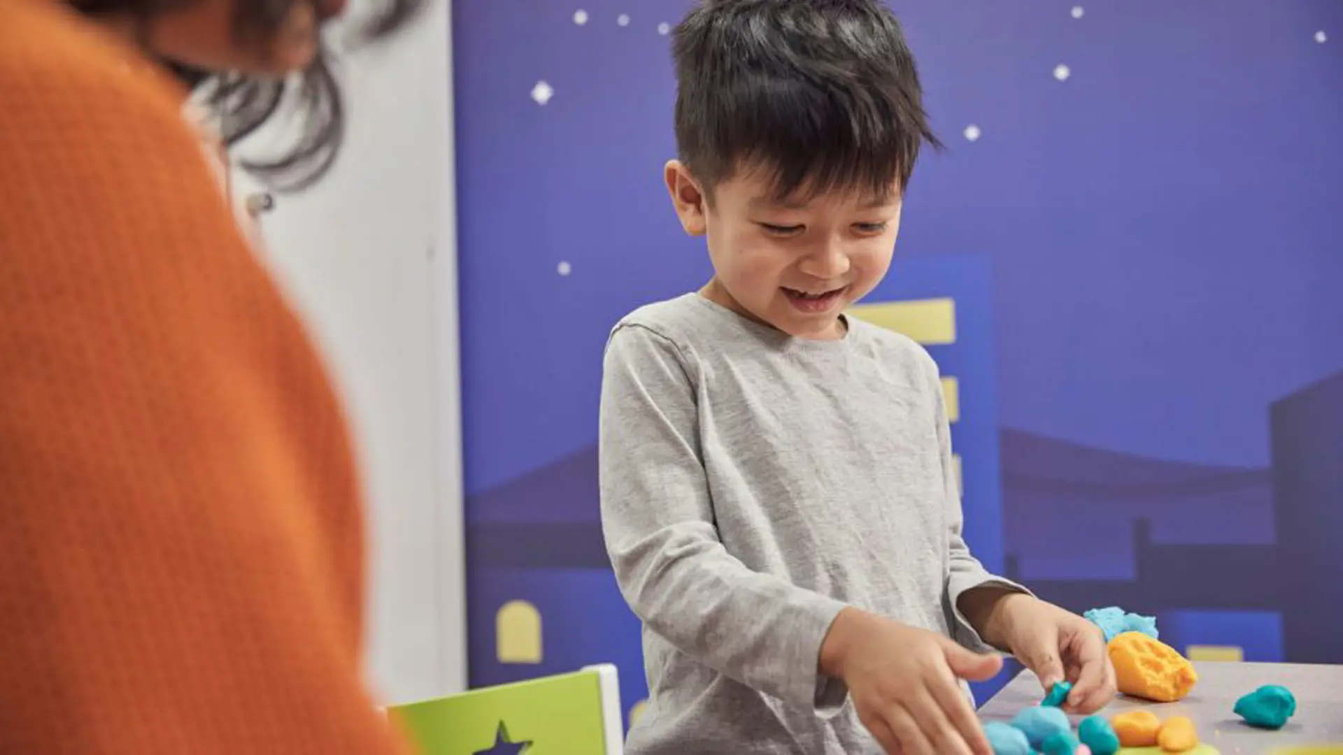 Child playing with arts and crafts