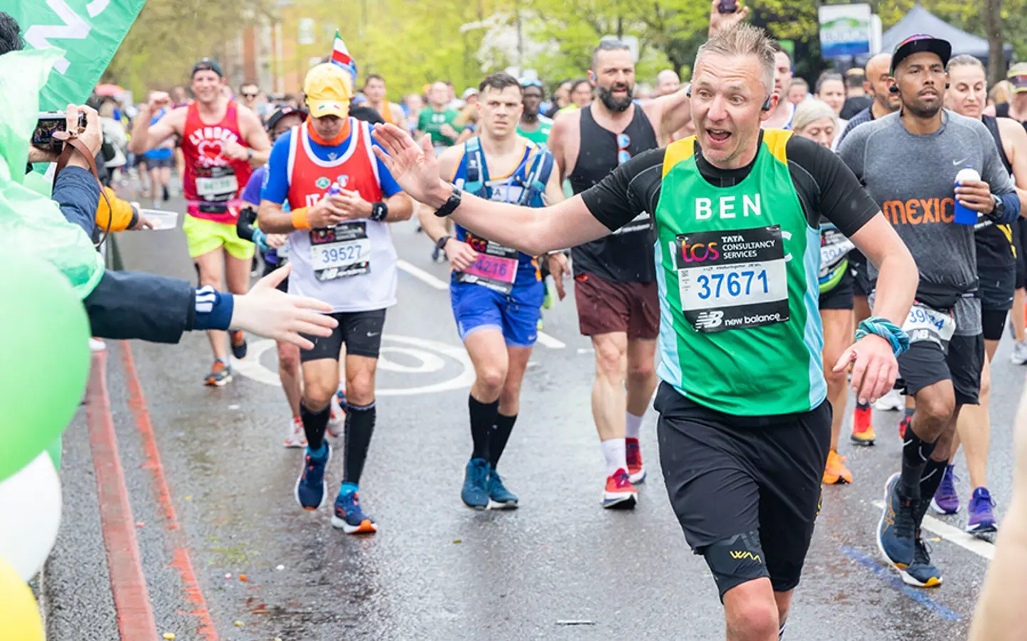 A team NSPCC member smiling while running in an event.