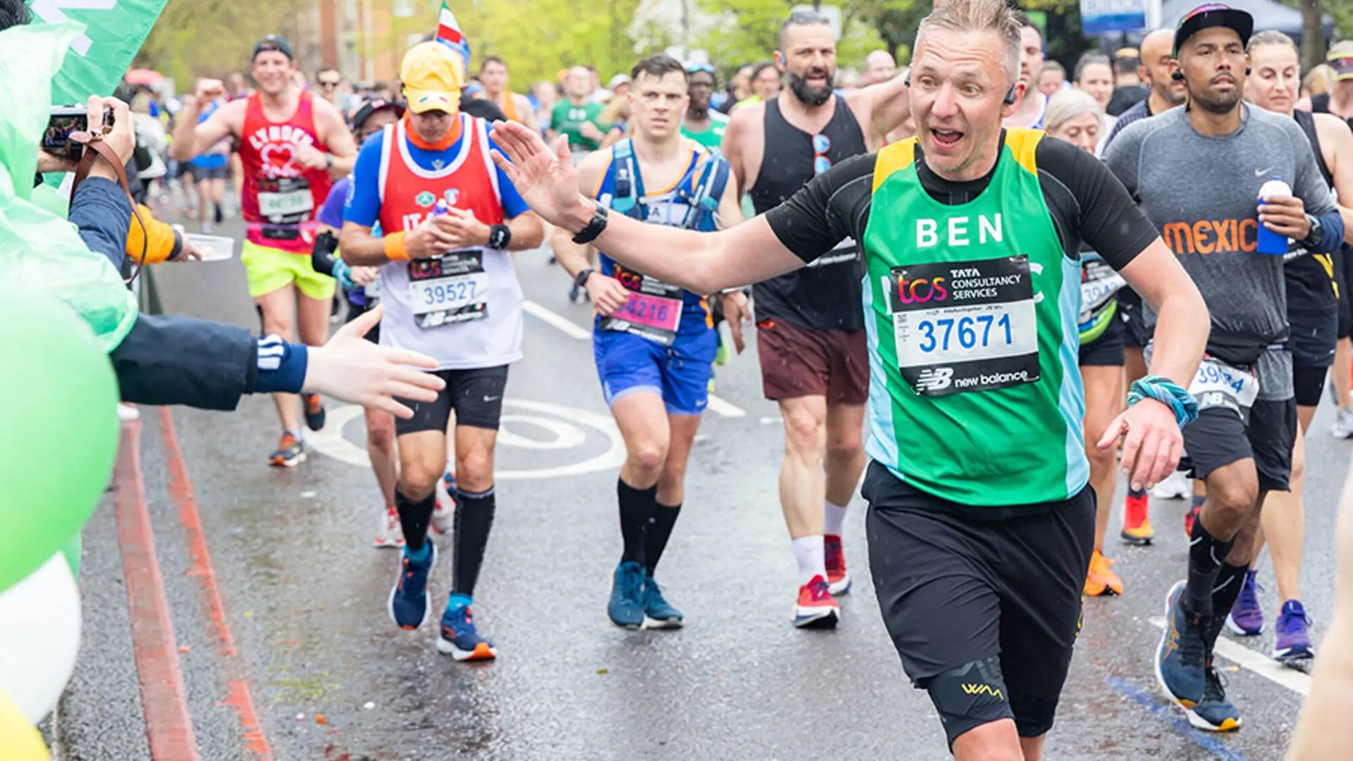 A team NSPCC member smiling while running in an event.