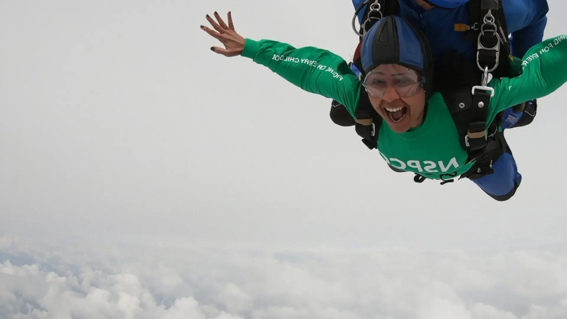 Photograph of a supporter doing a skydive challenge.