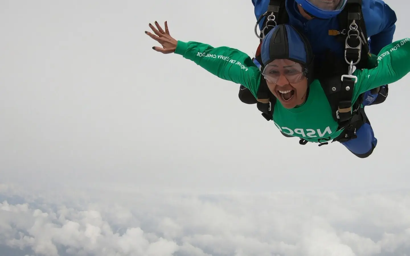 Photograph of a supporter doing a skydive challenge.
