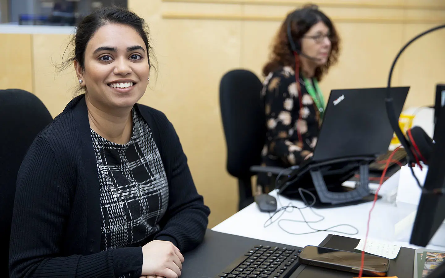 An NSPCC employee smiling while doing their work.